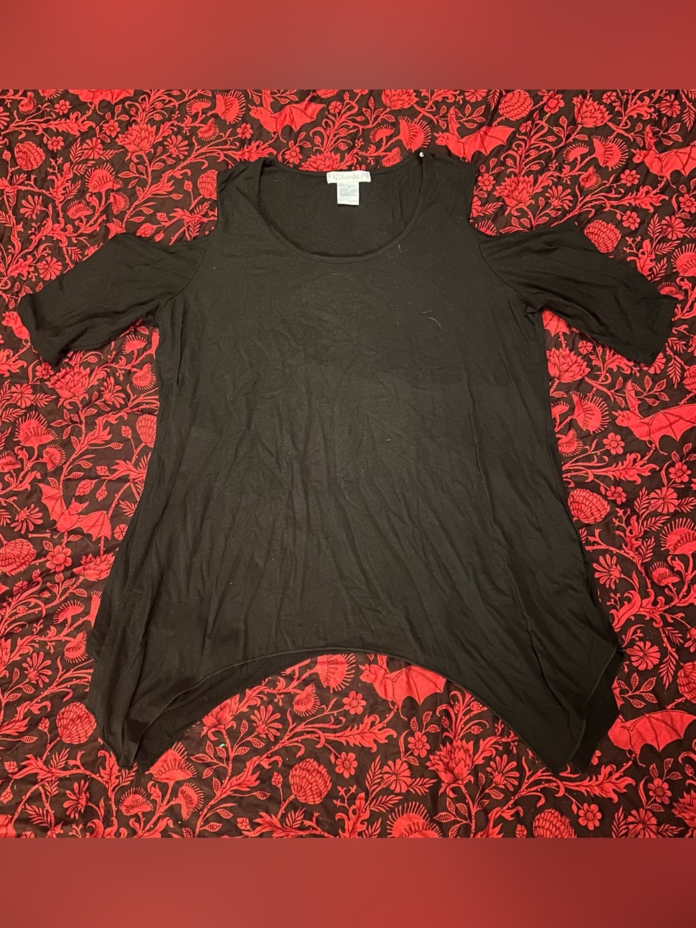 K. Jordan black quarter sleeve top with sharkbite hem and shoulder cutouts
